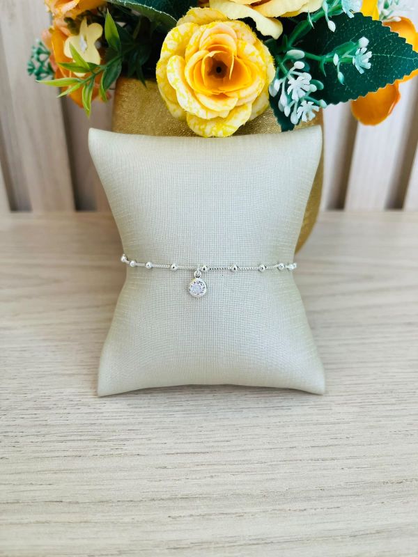 PULSEIRA DE BOLINHAS COM UM PONTO DE LUZ